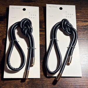 a new day Black Bag Charm Pair with Gold Tips